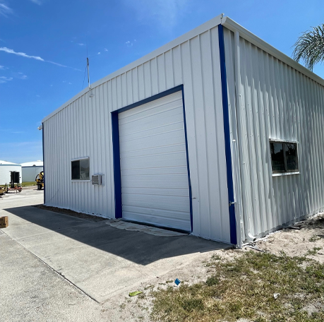 House painters in Port Saint Lucie, FL, delivering excellent service while painting a storage unit.